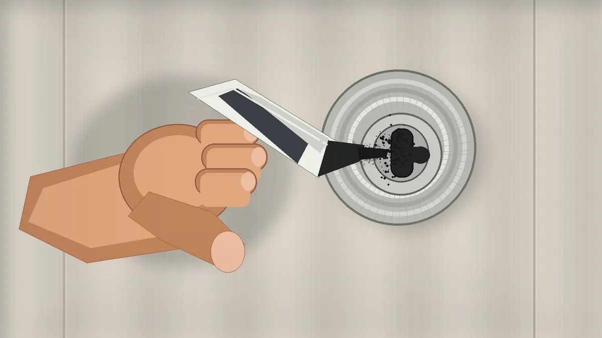 Applying dry lubricant to a door lock keyway